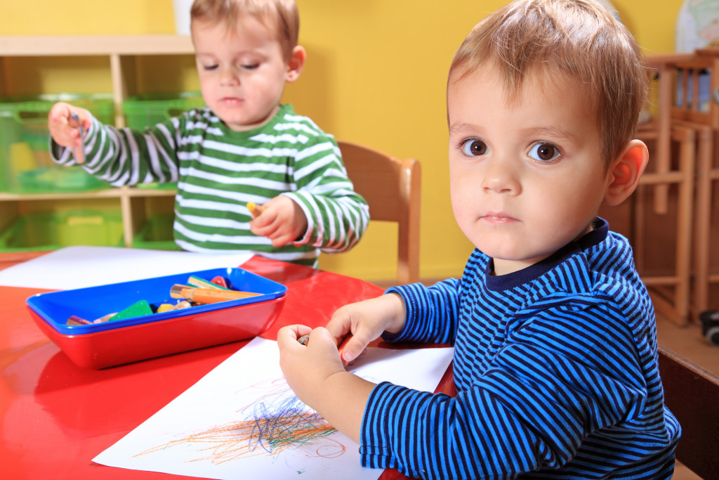 children with coloring materials