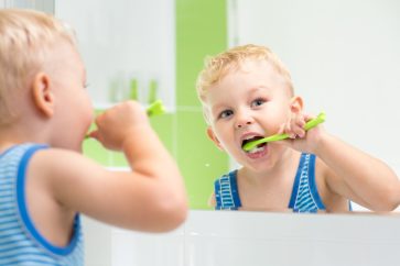 Little boy brushing teeth