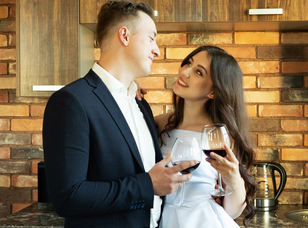 newly wed holding glass of wine