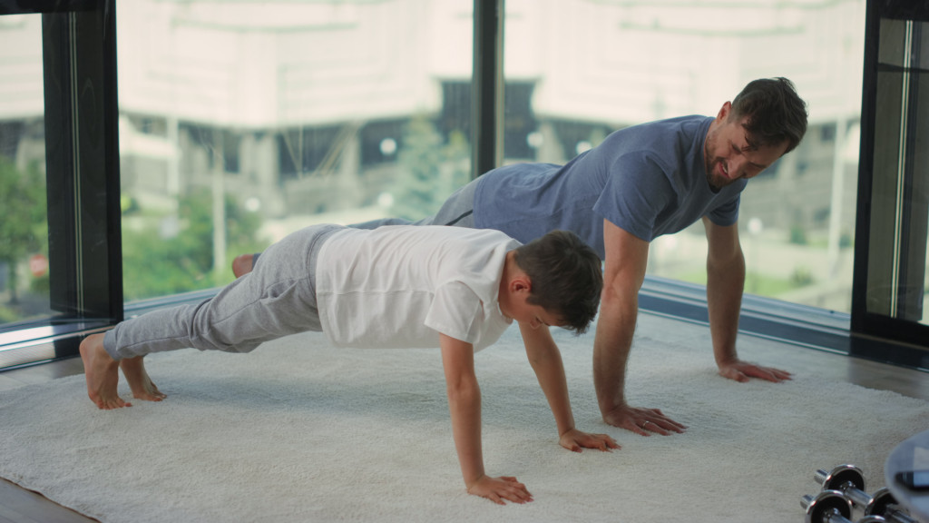 dad and son doing push ups